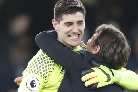 Chelsea's manager Antonio Conte hugs Chelsea's goalkeeper Thibaut Courtois at the end of the English Premier League soccer match between Chelsea and Middlesbrough at Stamford Bridge stadium in London, Monday, May 8, 2017. Chelsea won the match 3-0. (AP Photo/Frank Augstein)
