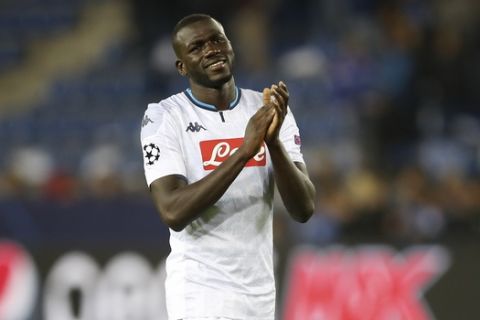 Napoli's Kalidou Koulibaly waves his fans at the end of the Champions League group E soccer match between Genk and Napoli at the KRC Genk Arena in Genk, Belgium, Wednesday, Oct. 2, 2019. (AP Photo/Francisco Seco)