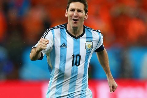 SAO PAULO, BRAZIL - JULY 09:  Lionel Messi of Argentina celebrates defeating the Netherlands in a shootout during the 2014 FIFA World Cup Brazil Semi Final match between the Netherlands and Argentina at Arena de Sao Paulo on July 9, 2014 in Sao Paulo, Brazil.  (Photo by Ronald Martinez/Getty Images)
