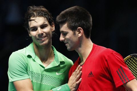 Serbia's Novak Djokovic, right, and Spain's Rafael Nadal at the end of their ATP World Tour Finals tennis match at the 02 Arena in London, Friday, Nov. 27, 2009. (AP Photo/Sang Tan)
