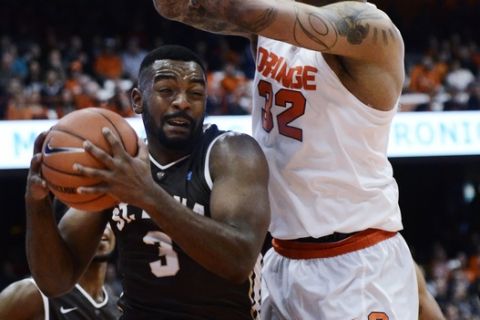 St. Bonaventure's Marcus Posley, left, escapes the clutches of Syracuse's Dajuan Coleman after catching a rebound during their NCAA college basketball game at at the Carrier Dome in Syracuse, N.Y., Tuesday, Nov. 17, 2015. Syracuse defeated St Bonaventure, 79-66. (AP Photo/Heather Ainsworth)