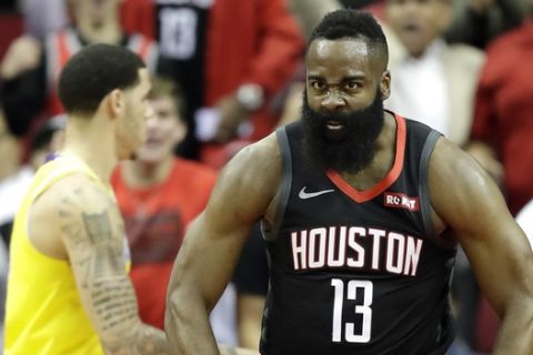 Houston Rockets' James Harden (13) reacts after dunking the ball against the Los Angeles Lakers during the first half of an NBA basketball game Thursday, Dec. 13, 2018, in Houston. (AP Photo/David J. Phillip)
