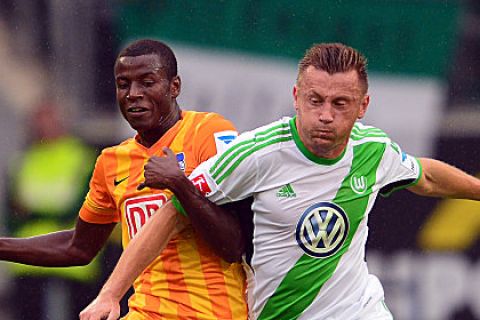 WOLFSBURG, GERMANY - AUGUST 31: Ivica Olic of Wolfsburg challenges for the ball with  Adrian Ramos of Berlin during the Bundesliga match between VfL Wolfsburg and Hertha BSC at Volkswagen Arena on August 31, 2013 in Wolfsburg, Germany.  (Photo by Stuart Franklin/Bongarts/Getty Images)
