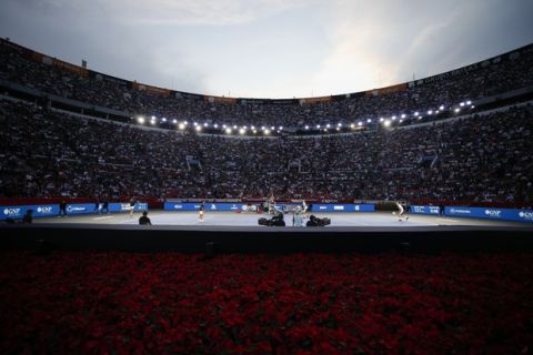Brothers Bob and Mike Bryan of the U.S., right, take on Mexico's Miguel Angel Reyes Varela and Santiago Gonzalez, in an exhibition doubles tennis match in the Plaza de Toros bullring in Mexico City, Saturday, Nov. 23, 2019. Roger Federer of Switzerland and Germany's Alexander Zverev were also to face off in the converted bullring Saturday, the fourth stop in a tour of Latin America by the tennis greats.(AP Photo/Rebecca Blackwell)