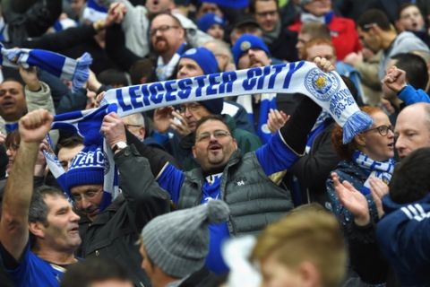 MANCHESTER, ENGLAND - FEBRUARY 06:  Leicester City supporters celebrate their team's win in the Barclays Premier League match between Manchester City and Leicester City at the Etihad Stadium on February 6, 2016 in Manchester, England.  (Photo by Michael Regan/Getty Images)