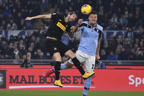 Inter Milans Diego Godin and Lazios Sergej Milinkovic-Savic jump for the ball during the Serie A soccer match between Lazio and inter Milan, at Rome's Olympic stadium, Sunday, Feb. 16, 2020. (Alfredo Falcone/LaPresse via AP)