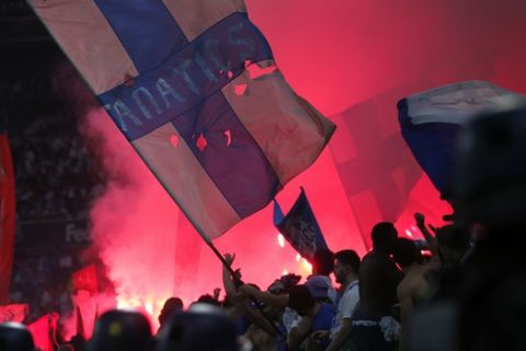 Fans set off flares during the Europa League Final soccer match between Marseille and Atletico Madrid at the Stade de Lyon in Decines, outside Lyon, France, Wednesday, May 16, 2018. (AP Photo/Thibault Camus)