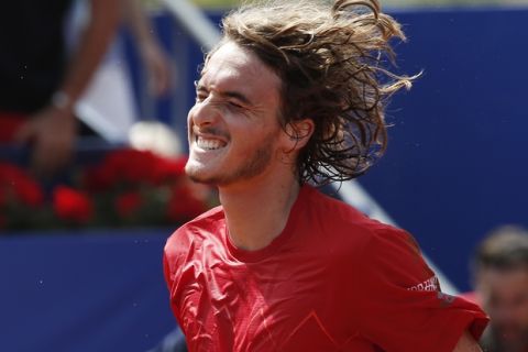 Stefanos Tsitsipas of Greece celebrates defeating Spain's Pablo Carreno Busta in two sets 7-5, 6-3, in his semifinal match against of the Barcelona Open Tennis Tournament in Barcelona, Spain, Saturday, April 28, 2018. (AP Photo/Manu Fernandez)