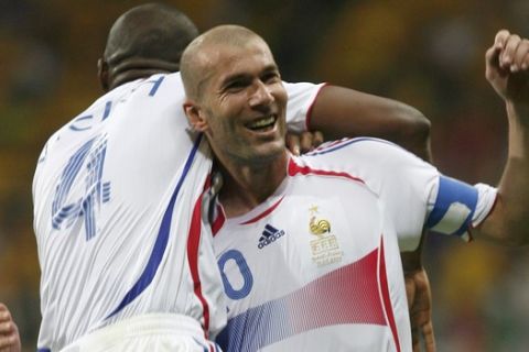 ** RETRANSMISSION OF WCFRA322 TO PROVIDE ALTERNATE CROP ** France's Zinedine Zidane, right, and his teammate Patrick Vieira celebrate after Thierry Henry, not seen, scored against Brazil during the Brazil v France quarterfinal soccer match at the World Cup stadium in Frankfurt, Germany, Saturday, July 1, 2006.  (AP Photo/Jasper Juinen) **MOBILE/PDA USAGE OUT **