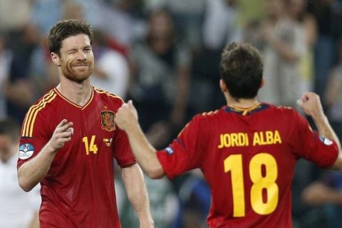 Spain's double-scorer Xabi Alonso reacts after winning the Euro 2012 soccer championship quarterfinal match between Spain and France in Donetsk, Ukraine, Saturday, June 23, 2012. (AP Photo/Michael Sohn) 