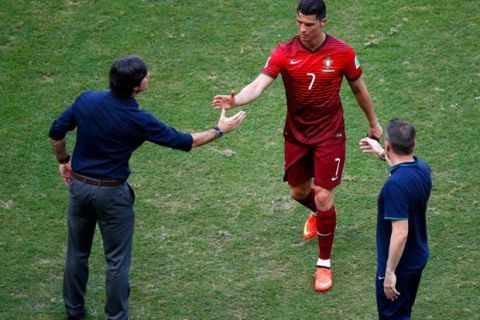 SALVADOR, BRAZIL - JUNE 16: Head coach Joachim Loew of Germany (L) shakes hands with Cristiano Ronaldo of Portugal as he leaves the field after the 2014 FIFA World Cup Brazil Group G match between Germany and Portugal at Arena Fonte Nova on June 16, 2014 in Salvador, Brazil.  (Photo by Matthew Lewis/Getty Images)