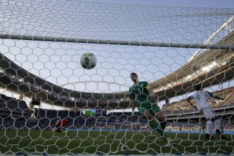 Algeria's Ayoub Adbellaoui looks on helplessly as the ball enters his goal after Honduras' Antony Lozano scored during a group D match of the men's Olympic football tournament at the Rio Olympic Stadium in Rio De Janeiro, Brazil, Thursday, Aug. 4, 2016. (AP Photo/Leo Correa)