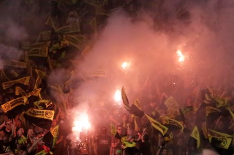 Dortmund fans light fireworks prior to the Champions League Group H soccer match between APOEL Nicosia and Borussia Dortmund at GSP stadium, in Nicosia, Cyprus, on Tuesday, Oct. 17, 2017. (AP Photo/Petros Karadjias)