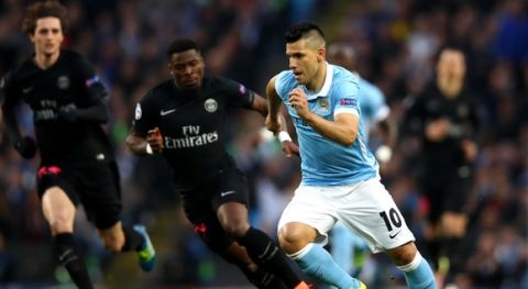 "MANCHESTER, ENGLAND - APRIL 12:  Sergio Aguero of Manchester City is chased by Serge Aurier of Paris Saint-Germain during the UEFA Champions League quarter final second leg match between Manchester City FC and Paris Saint-Germain at the Etihad Stadium on April 12, 2016 in Manchester, United Kingdom.  (Photo by Clive Brunskill/Getty Images)"