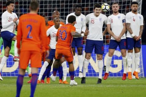 Memphis Depay, 10, of the Netherlands hits a freekick during the international friendly soccer match between the Netherlands and England at the Amsterdam ArenA in Amsterdam, Netherlands, Friday, March 23, 2018. (AP Photo/Peter Dejong)