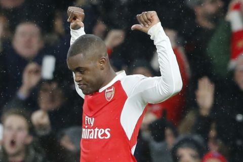 Arsenal's Joel Campbell celebrates after scoring during the English Premier League soccer match between Arsenal and Swansea City at the Emirates stadium in London, Wednesday, March 2, 2016.(AP Photo/Frank Augstein)