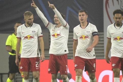 Leipzig's Marcel Sabitzer, second left, celebrates after scoring his side's second goal during the Champions League group G soccer match between RB Leipzig and Zenit St. Petersburg in Leipzig, Germany, Wednesday, Oct. 23, 2019. (AP Photo/Jens Meyer)