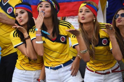 CUIABA, BRAZIL - JUNE 24:  Colombia fans blow kisses during the 2014 FIFA World Cup Brazil Group C match between Japan and Colombia at Arena Pantanal on June 24, 2014 in Cuiaba, Brazil.  (Photo by Christopher Lee/Getty Images)