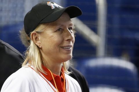 Former tennis player Martina Navratilova watches batting practice before the start of a baseball game between the Miami Marlins and the Washington Nationals, Monday, June 19, 2017, in Miami. (AP Photo/Wilfredo Lee)