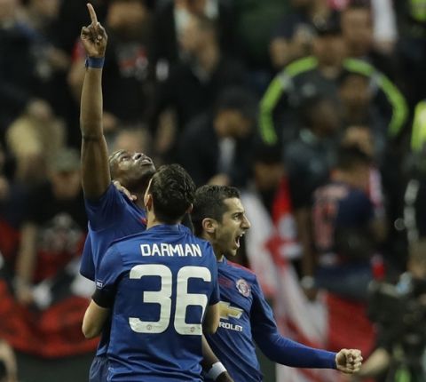 Manchester's Paul Pogba, left, celebrates after scoring the opening goal during the soccer Europa League final between Ajax Amsterdam and Manchester United at the Friends Arena in Stockholm, Sweden, Wednesday, May 24, 2017. (AP Photo/Michael Sohn)