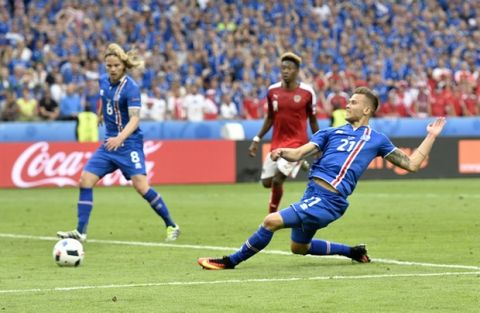 Iceland's Arnor Ingvi Traustason scores his team's second goal during the Euro 2016 Group F soccer match between Iceland and Austria at the Stade de France in Saint-Denis, north of Paris, France, Wednesday, June 22, 2016. (AP Photo/Martin Meissner)