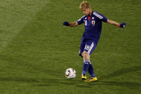Japan's Keisuke Honda kicks the ball to score the opening goal during the World Cup group E soccer match between Denmark and Japan at Royal Bafokeng Stadium in Rustenburg, South Africa, on Thursday, June 24, 2010.  (AP Photo/Marcio Jose Sanchez)