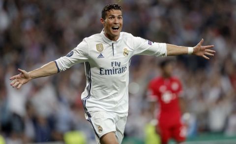 Real Madrid's Cristiano Ronaldo celebrates after scoring his side's third goal during the Champions League quarterfinal second leg soccer match between Real Madrid and Bayern Munich at Santiago Bernabeu stadium in Madrid, Spain, Tuesday April 18, 2017. (AP Photo/Daniel Ochoa de Olza)