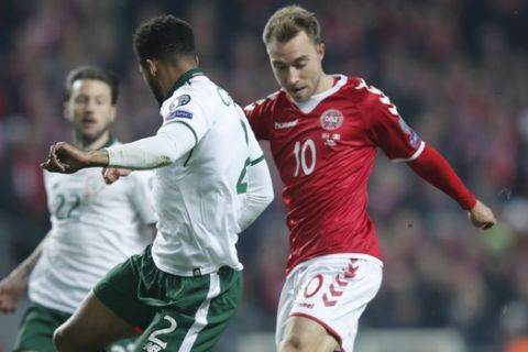 Ireland's Cyrus Christie and Denmark's Christian Eriksen , right, vie for the ball during the World Cup qualifying play-off first leg soccer match between Denmark and the Republic of Ireland at Parken stadium in Copenhagen, Denmark, Saturday, Nov. 11, 2017. (Jens Dresling/Ritzau via AP)