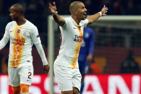 Galatasaray midfielder Sofiane Feghouli celebrates after scoring his side's opening goal during the Champions League Group D soccer match between Galatasaray and Porto in Istanbul, Tuesday, Dec. 11, 2018. (AP Photo/Lefteris Pitarakis)