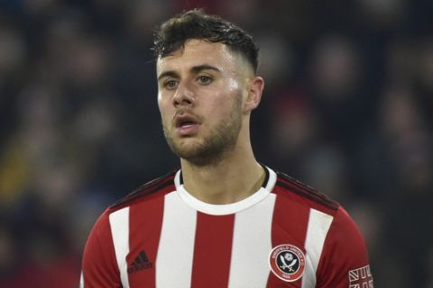 Sheffield United's George Baldock during the English Premier League soccer match between Sheffield United and Manchester City at Bramall Lane in Sheffield, England, Tuesday, Jan. 21, 2020. (AP Photo/Rui Vieira)