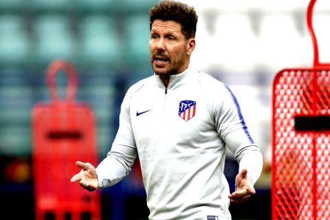 Atletico's head coach Diego Simeone gestures during a training session at the Lillekula Stadium, a day ahead of UEFA Super Cup final soccer match between Real Madrid and Atletico Madrid in Tallinn, Estonia, Tuesday, Aug. 14, 2018. (AP Photo/Pavel Golovkin)