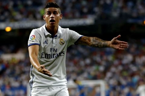 Real Madrid's James Rodriguez gestures to an assistant referee during the Spanish La Liga soccer match between Real Madrid and Celta Vigo at the Santiago Bernabeu stadium in Madrid, Saturday, Aug. 27, 2016. Real Madrid won 2-1. (AP Photo/Francisco Seco)
