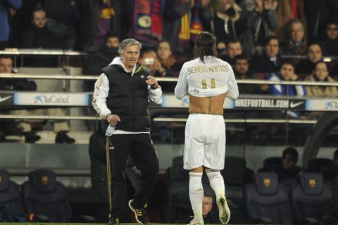 Real Madrid's Portuguese coach Jose Mourinho (L) speaks with Real Madrid's defender Sergio Ramos (R) during the second leg of the Spanish Cup quarter-final "El clasico" football match Barcelona vs Real Madrid at the Camp Nou stadium in Barcelona on January 25, 2012. AFP PHOTO / PEDRO ARMESTRE (Photo credit should read PEDRO ARMESTRE/AFP/Getty Images)