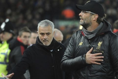 FILE - In this Sunday, Dec. 16, 2018 file photo Liverpool manager Juergen Klopp, right, and Manchester United manager Jose Mourinho seen prior to the English Premier League soccer match between Liverpool and Manchester United at Anfield in Liverpool, England. Manchester United says Jose Mourinho has left the Premier League club with immediate effect. The decision was announced Tuesday Dec.18, 2018, two days after a 3-1 loss to Liverpool left United 19 points off the top of the Premier League after 17 games. (AP Photo/Rui Vieira, File)