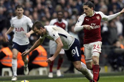 Tottenham's Harry Kane, center, and Arsenal's Hector Bellerin battle for the ball during the English Premier League soccer match between Tottenham Hotspur and Arsenal at Wembley Stadium, London, Saturday, Feb. 10, 2018. (AP Photo/Tim Ireland)