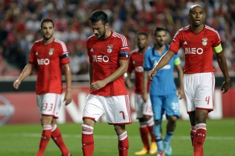 Benfica's Andreas Samaris, second left, from Greece, reacts after failing to clear the ball from a corner during a Champions League Group C soccer match between Benfica and Zenit at Benfica's Luz stadium in Lisbon, Portugal, Tuesday, Sept. 16, 2014. Zenit defeated Benfica 2-0. (AP Photo/Francisco Seco)