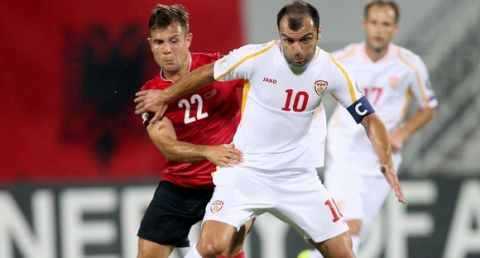 Albania's Amir Abrashi (L) vies with Macedonia's Goran Pandev (R) during the World Cup 2018 qualifier football match Albania vs Macedonia in Loro Borici stadium in the city of Shkoder on September 5, 2016.   / AFP / GENT SHKULLAKU        (Photo credit should read GENT SHKULLAKU/AFP/Getty Images)