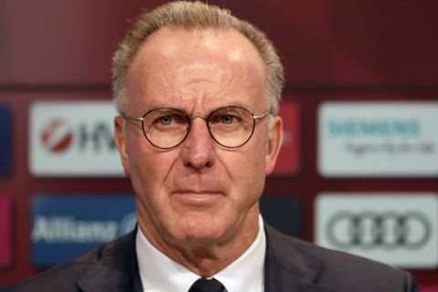 Bayern Munich's CEO Karl-Heinz Rummenigge listens to questions of journalists during the presentation of club's new coach Jupp Heynckes at a news conference in Munich, Germany, Monday, Oct. 9, 2017. Heynckes coached the Bundesliga team already from 1987 to 1991, 2009 and from 2011 to 2013. (AP Photo/Matthias Schrader)