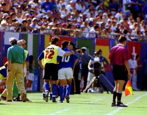 23 JUN 1994:  ROBERTO BAGGIO OF ITALY IS LED  OFF THE FIELD AFTER BEING SUBSTITUTED DURING THE FIRST HALF AGAINST NORWAY IN THE 1994 WORLD CUP.  BAGGIO CAME OFF TO MAKE WAY FOR RESERVE GOALKEEPER LUCA MARCHEGIANI WHO REPLACED GIANLUCA PAGILUCA AFTER PAGLI
