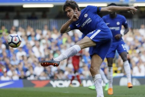 Chelsea's Marcos Alonso kicks the ball as he tries to score during the English Premier League soccer match between Chelsea and Liverpool at Stamford Bridge stadium in London, Sunday, May 6, 2018. (AP Photo/Kirsty Wigglesworth)