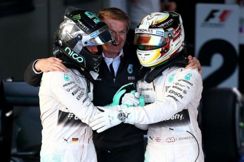 MELBOURNE, AUSTRALIA - MARCH 15:  Lewis Hamilton of Great Britain and Mercedes GP shakes hands with Nico Rosberg of Germany and Mercedes GP in Parc Ferme after winning the Australian Formula One Grand Prix at Albert Park on March 15, 2015 in Melbourne, Australia.  (Photo by Mark Thompson/Getty Images)