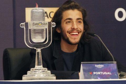 Salvador Sobral from Portugal smiles as he speaks after winning the Final of the Eurovision Song Contest with his song "Amar pelos dois" during a press conference in Kiev, Ukraine, Saturday, May 13, 2017. (AP Photo/Sergei Chuzavkov)