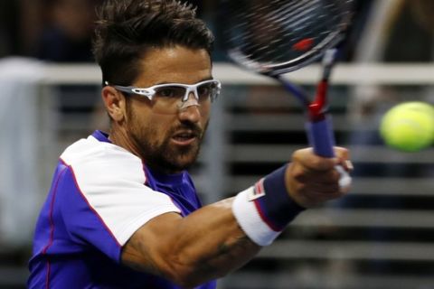 Janko Tipsarevic, of Serbia, returns a shot from Diego Schwartzman, of Argentina, during the second round of the U.S. Open tennis tournament, Wednesday, Aug. 30, 2017, in New York. (AP Photo/Michael Noble)