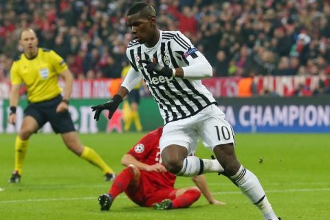 "MUNICH, GERMANY - MARCH 16:  Paul Pogba of Juventus celebrates scoring his team's first goal during the UEFA Champions League round of 16, second Leg match between FC Bayern Muenchen and Juventus at the Allianz Arena on March 16, 2016 in Munich, Germany.  (Photo by Alexander Hassenstein/Bongarts/Getty Images)"