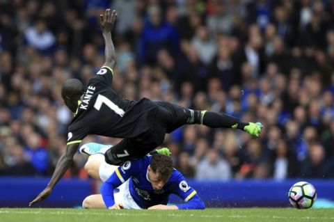 Chelsea's N'Golo Kante is challenged by Everton's Ross Barkley, during the English Premier League soccer match between Everton and Chelsea, at Goodison Park, in Liverpool, England, Sunday April 30, 2017. (Nigel French/ PA via AP)