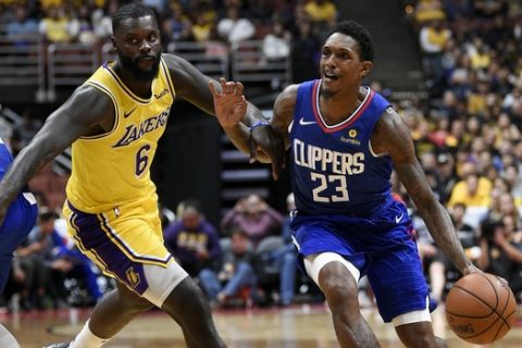 Los Angeles Clippers guard Lou Williams, right, handles the ball past Los Angeles Lakers guard Lance Stephenson during the second half of an NBA preseason basketball game in Anaheim, Calif., Saturday, Oct. 6, 2018. The Clippers won 103-87. (AP Photo/Kelvin Kuo)