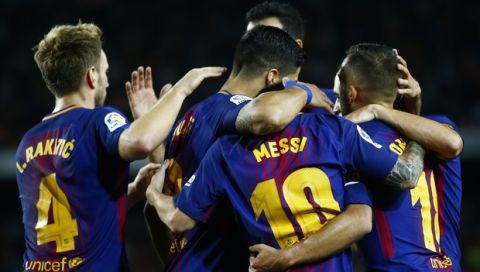 FC Barcelona's Lionel Messi celebrates with team mates after scoring during the Spanish La Liga soccer match between FC Barcelona and Espanyol at the Camp Nou stadium in Barcelona, Spain, Saturday, Sept. 9, 2017. (AP Photo/Manu Fernandez)