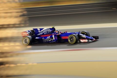 Toro Rosso driver Carlos Sainz Jr. of Spain steers his car during the second practice session for the Bahrain Formula One Grand Prix, at the Formula One Bahrain International Circuit in Sakhir, Bahrain, Friday, April 14, 2017. The Bahrain Formula One Grand Prix will take place on Sunday. (AP Photo/Hassan Ammar)