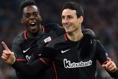 Athletic Bilbao's forward Aritz Aduriz (R) celebrates with with Athletic Bilbao's forward Inaki Williams after scoring a goal during the UEFA Europa League football match between Marseille and Athletic Bilbao at Velodrome Stadium in Marseille on February 18, 2016. AFP PHOTO / ANNE-CHRISTINE POUJOULAT / AFP / ANNE-CHRISTINE POUJOULAT        (Photo credit should read ANNE-CHRISTINE POUJOULAT/AFP/Getty Images)