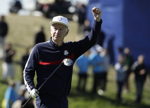 Tennis legend John McEnroe of the US gestures as he walks from the 2nd tee in the Ryder Cup Celebrity Challenge match at Le Golf National in Saint-Quentin-en-Yvelines, outside Paris, France, Tuesday, Sept. 25, 2018. The 42nd Ryder Cup will be held in France from Sept. 28-30, 2018 at Le Golf National. (AP Photo/Matt Dunham)